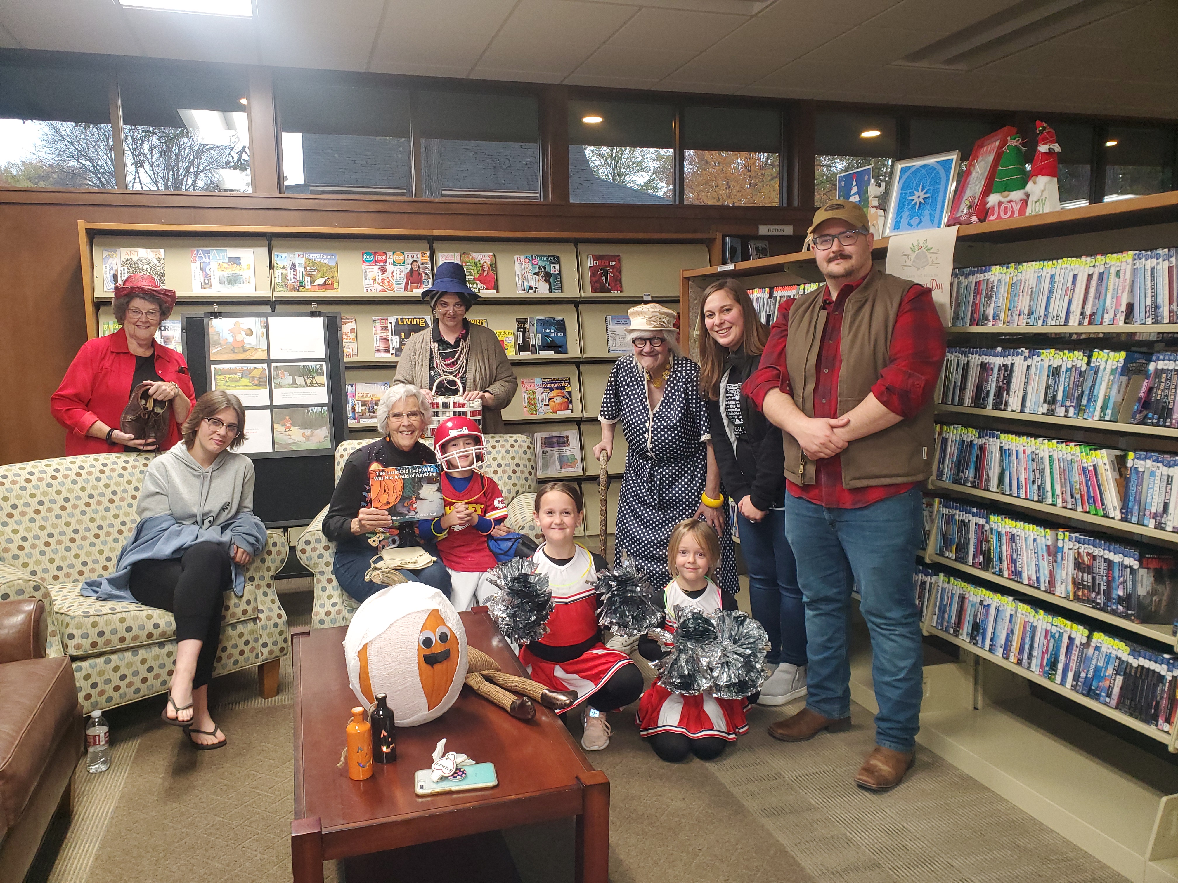 Trick or Read Program Sponsored by the Friends. Books passed out to children. Shown is the volunteers who read the story to the children attending the event.